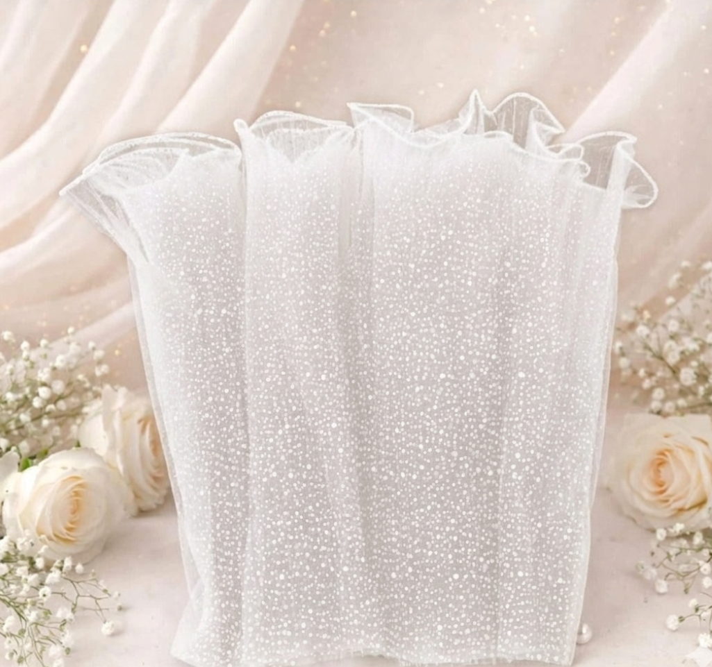 White lace glove on a decorative background with flowers

